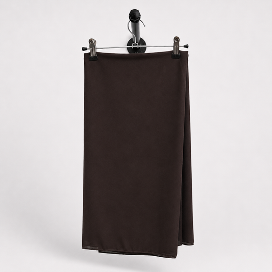 A dark brown, solid-colored fabric panel or curtain hanging from a black metal hanger with two silver clips against a light gray background.